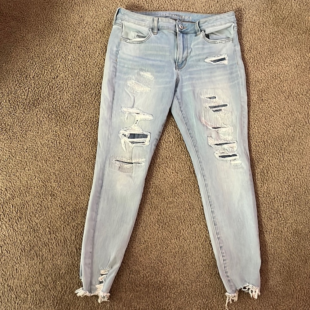 American Eagle like new Skinny Jeans size 12 with patches behind rips